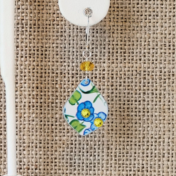 Vintage Elite Tin My Baby Blue Earrings in blue and yellows with white background