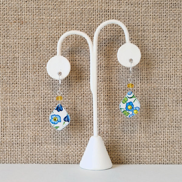 Vintage Elite Tin My Baby Blue Earrings in blue and yellows with white background